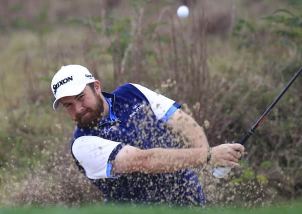 Shane Lowry of Ireland hits a shot from the bunker on the 6th hole during the second round of the BMW Masters golf tournament at the Lake Malaren Golf Club in Shanghai. (AP Photo)