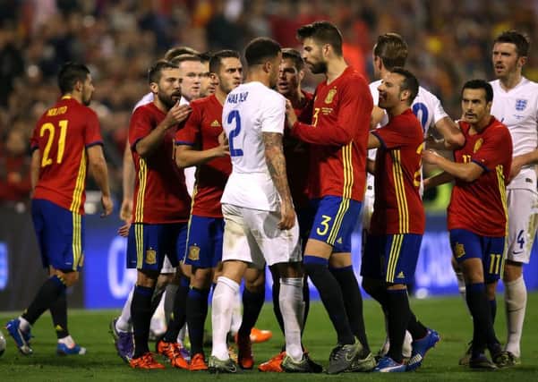 FRIENDLY? - Tempers flare between players from Spain and England during an international friendly at the Rico Perez Stadium, Alicante. Spain won 2-0. Picture: PA