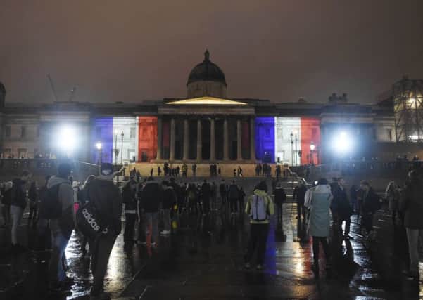 The National Gallery, in London, illuminated with the colours of the French tricolor as London stands in solidarity with its sister European capital