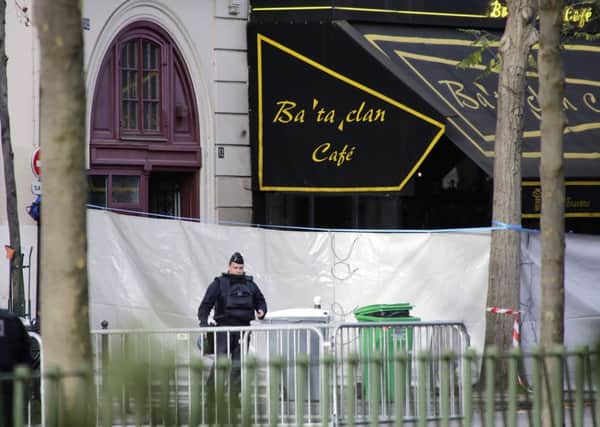 A police officer stands guard outside the Bataclan concert hall, Paris