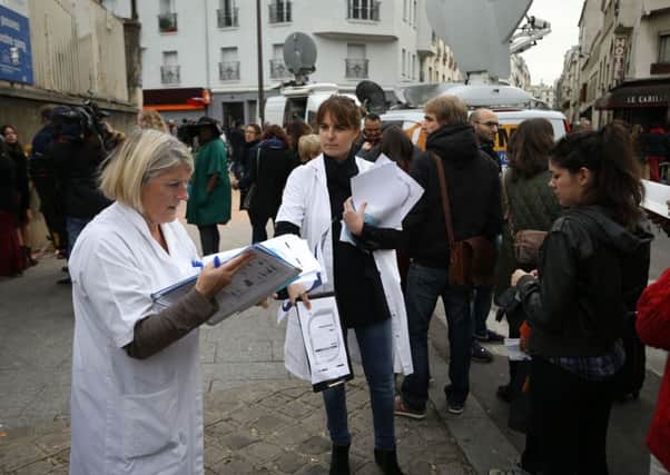 People queue to give blood at a makeshift centre in Paris. Pic: Steve Parsons/PA