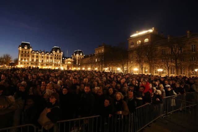 Crowds gathered to enter Notre-Dame Cathedral for a memorial service, following the terrorist attacks on Friday evening.