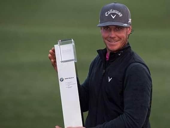 Kristoffer Broberg with his trophy after victory in the BMW Masters (Picture: Getty Images).