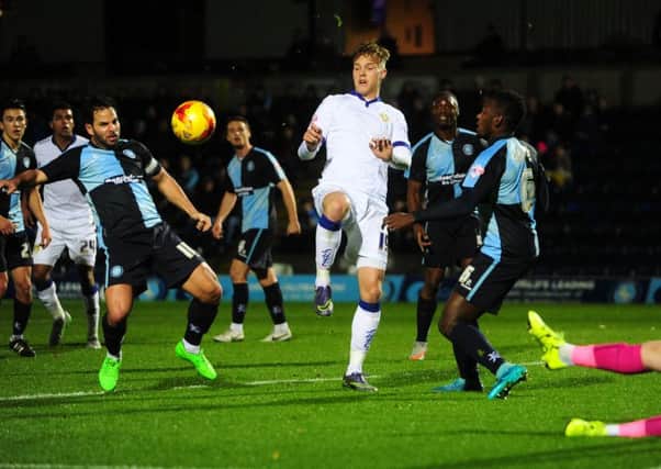 Leeds United's Lee Erwin takes on Wycombe's Sam Wood on Friday. 
PIC: Jonathan Gawthorpe.