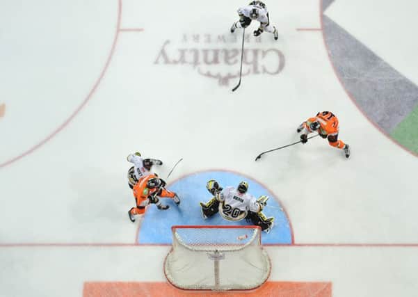 LOOKING DOWN: Sheffield Steelers' Chris Lawrence, right, bears down on the Nottingham Panthers goal. The visitors won 4-1. Picture: Dean Woolley.