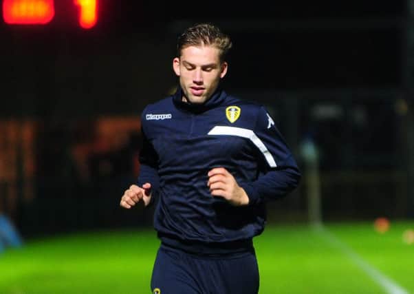 Charlie Taylor warms up on the touchline at Wycombe.