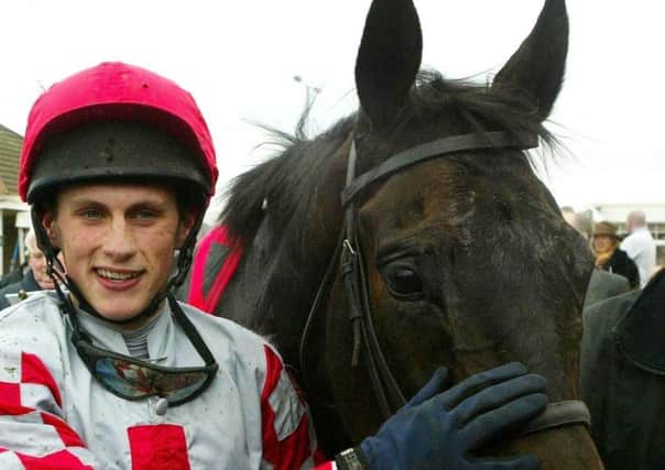 Jockey Keith Mercer with Joes Edge after winning the Gala Casinos Daily Record Scottish Grand National at Ayr racecourse, Saturday April 16, 2005.