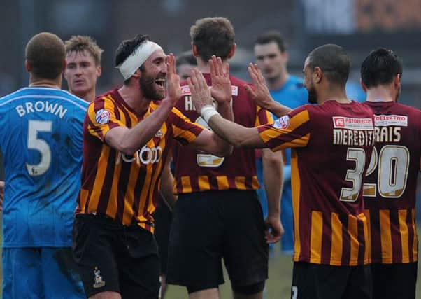 Bradford City's Rory McArdle (left) celebrates with James Meredith at the final whistle during the FA Cup Fifth Round match at the Valley Parade, Bradford.