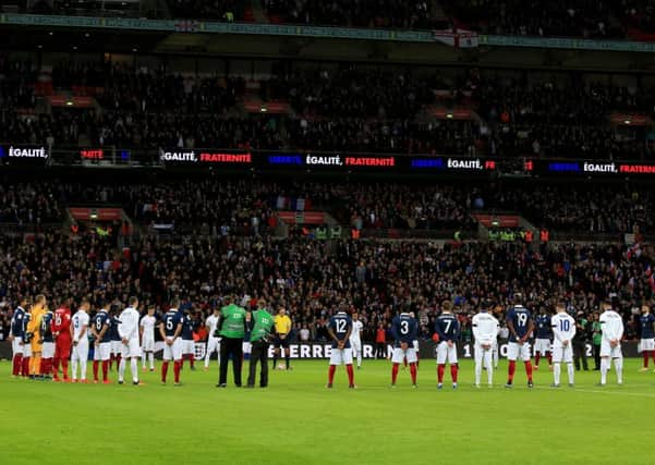 England players observe a minute of silence with their French counterparts before the international friendly match at Wembley Stadium. Press Association picture.