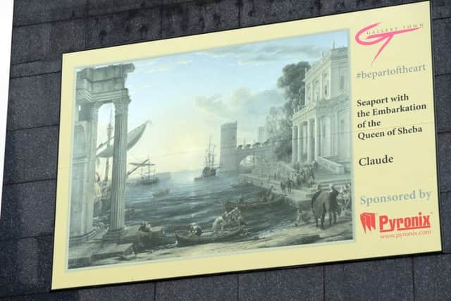 A reporoduction of Claude's Seaport with the Embarkation of the Queen of Sheba , in situ above The Corn Law Rhymer pub in Rotherham town centre . Picture Scott Merrylees