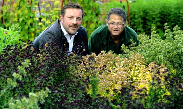 Marcus Black(left) of Slingsby Gin  in the kitchen garden at Rudding Park Hotel in Harrogate  with gardener Adrian Reeve
