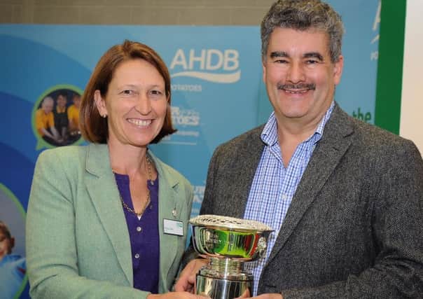 Nick Vermont being presented with the 2015 British Potato Industry Award by AHDB Potatoes by Fiona Fell, chairman of AHDB Potatoes.