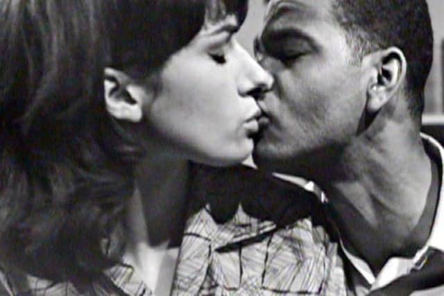 What is believed to be the earliest known inter-racial kiss on British television, during You in Your Small Corner and shown on ITV in June 1962 as a Granada play of the week.  The actors are Lloyd Reckord, the playwright's brother, and Elizabeth MacLennan.