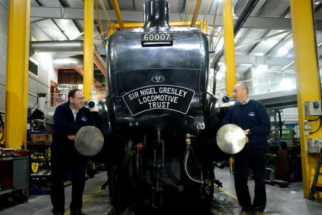 John Wilkinson, Deputy Chairman  of the Sir Nigel Gresley Locomotive Trust (left) with volunteer Mike Page