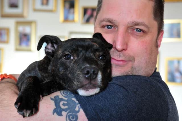 Mark Parry from Hipperholme near Halifax has adopted Damson, from the Dogs' Trust in Leeds. Picture: Tony Johnson
