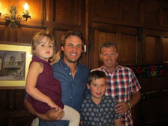 Chris Hanson with his daughter Jessica, three, his 10-year-old nephew George and his caddie Steve Tooby.