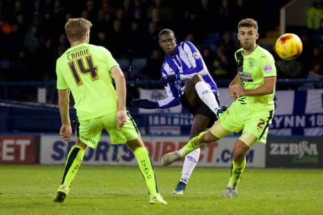 SEALING THE DEAL: Owls Lucas Joao scores his side's third goal to cpmplete a 3-1 victory over Huddersfield Town. Picture Steve Ellis.