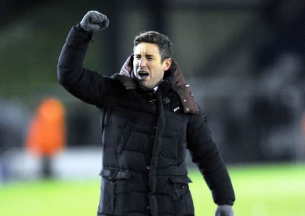 DELIGHTED: Barnsley manager Lee Johnson celebrates his team's victory at Oldham. Picture: Steve Riding.