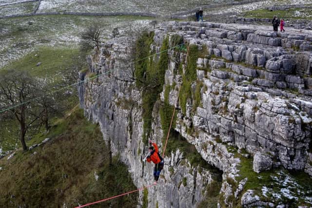 Daniel Laruelle, 21, from Newcastle, took his trumpet and played it on a highline 400ft above the ground ground in Malham in the Yorkshire Dales. Picture: Ross Parry Agency