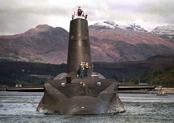 The Royal Navy's 16,000 ton Trident-class nuclear submarine Vanguard photographed in 2002. PA Wire