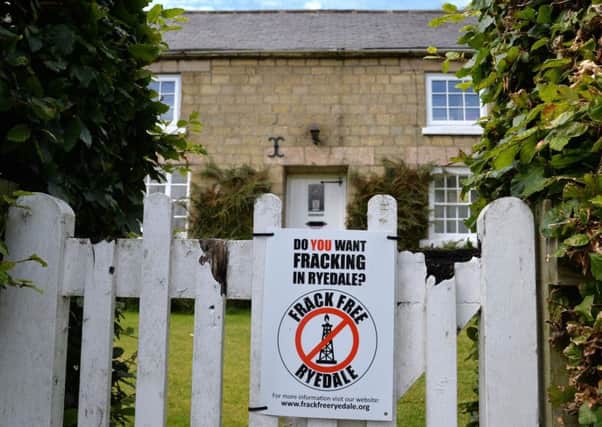 An anti-fracking poster on the garden gate of a house in Kirby Misperton. Picture: Anna Gowthorpe