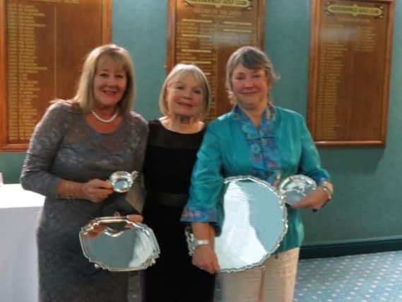 Huddersfield GC lady golfer of the year Alison Tracey, right, with Sue Ramsbottom, left, winner of the Seniors and Second Division Trophy, and lady captain Jean Gee.