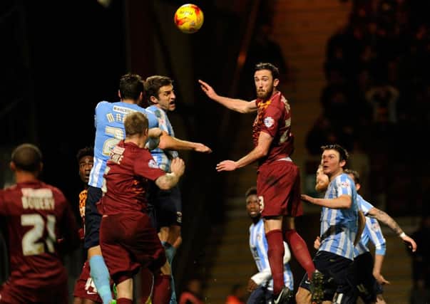 Bradford's Rory McArdle rises for a corner.
 (Picture: Bruce Rollinson)