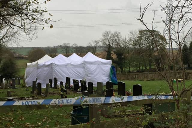 The skulls of two 16-year-olds were removed from a grave in a "sickening" escalation of a feud between travelling families