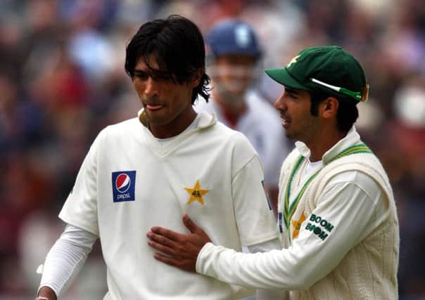 Pakistan's Mohammad Amir being advised by his captain Salman Butt back in August 2010 (Picture: David Jones/PA Wire).