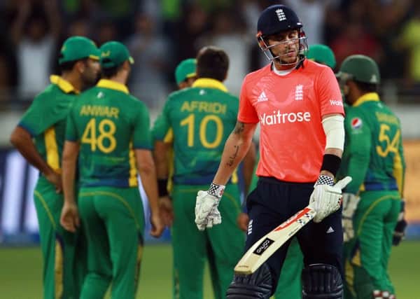 England batsman Alex Hales walks disconsolately back to the pavilion after losing his wicket to Pakistans Shahid Afridi. But he and his England team-mates were ultimately smiling as they defeated Pakistan by three runs to wrap up the T20 series 2-0 (Picture: AP).