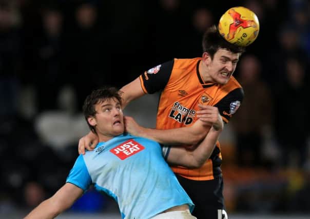 Derby County's Chris Martin (left) and Hull City's Harry Maguire.
