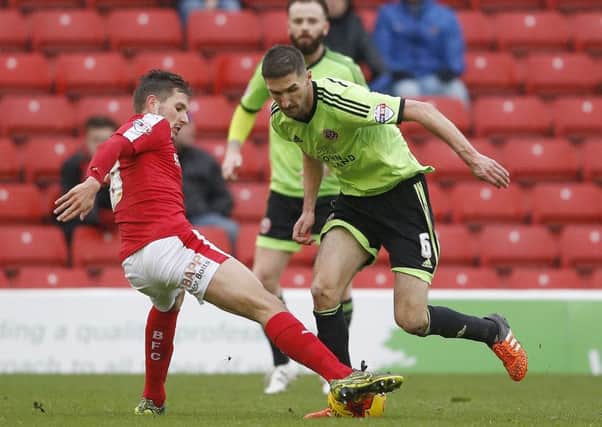 Sheffield United's Chris Basham is challenged by barnsley's Conor Hourihane. Basham put Blades ahead but Hourihane scored a late equaliser (Picture: Simon Bellis/Sportimage).
