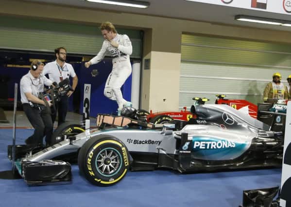 Mercedes driver Nico Rosberg of Germany celebrates after winning  the Emirates Formula One Grand Prix at the Yas Marina racetrack in Abu Dhabi. Picture: AP