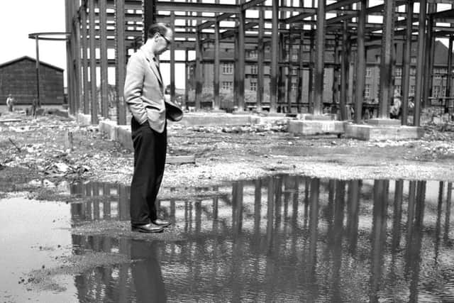 Larkin in reflective pose at the site of the first library building at Hull University. (credit: University of Hull).