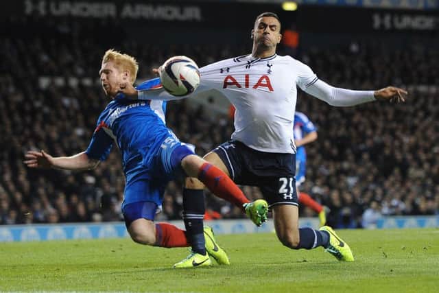 Tottenham Hotspur's Nadir Chadli  and Hull City's Paul McShane battle for the ball during the Capital One Cup, Fourth Round match at White Hart Lane in October 2013. Spurs won on penalties.