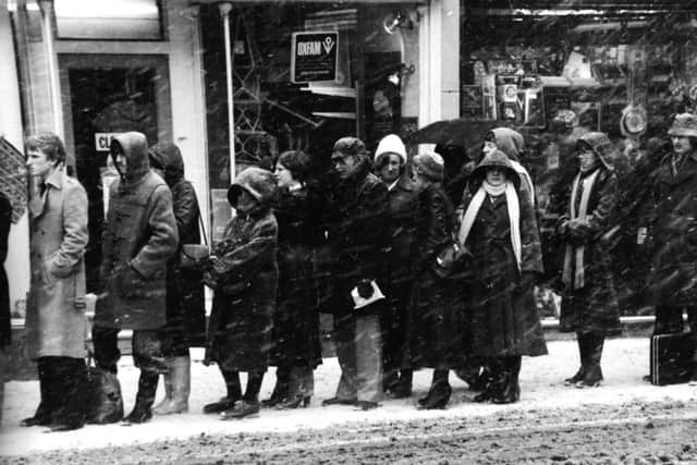 Leeds, 15th February 1979.

The snow lashes down on people queuing for a bus to transport them home as the city evening rush hour begins in Boar Lane.
