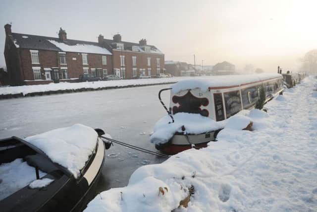 Canal boats on a frozen Stainforth and Keadby Canal at Thorne, Doncaster on Tuesday December 7, 2010. Picture: Anna Gowthorpe/PA Wire