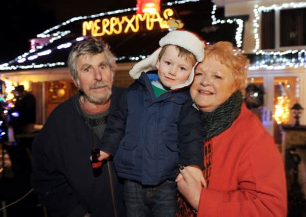 Jon and Jennifer Sharpe and grandson Aiden at last year's Christmas lights switch on