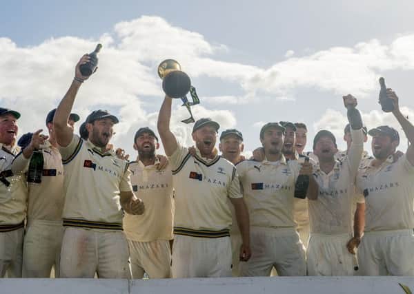 Yorkshire's players hold the 2015 LV County Championship trophy aloft.