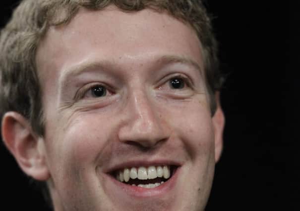 Mark Zuckerberg says he wants to use his wealth to help make the world a better place.  (AP Photo/Paul Sakuma)