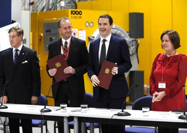 Coun Julie Dore (right) signed the devolution deal alongside Chancellor George Osborne in October
