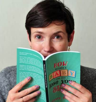 Ilkley parenting blogger Kirsty Smith, aka Eeh Bah Mum, with her debut book, How to Have a Baby and Not Lose Your Sh*t. Picture Tony Johnson