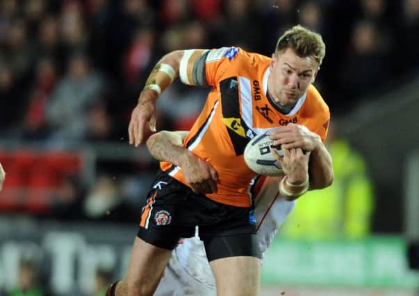 Castleford's Michael Shenton is tackled by Mark Percival of St Helens
