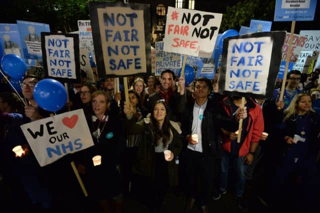 Junior doctors and medical students protest against the proposed changes to their contracts during a rally in Victoria Gardens, Leeds.Picture: Anna Gowthorpe