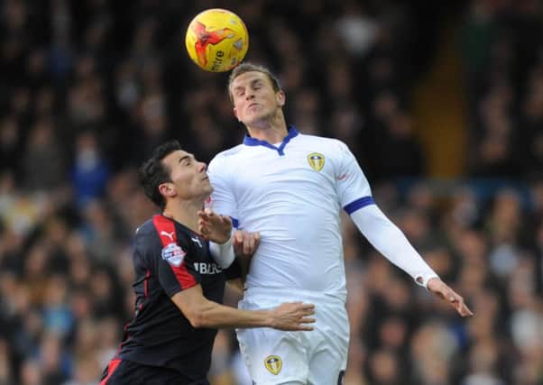Rotherham United's Stephen Kelly battling with Leeds United's Chris Wood. Picture: Simon Hulme
