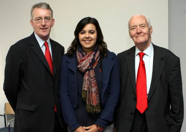 Emily Benn with her grandfather Tony Benn and uncle Hilary Benn, as she has demanded a retraction from Alex Salmond after he said that the shadow foreign secretary's father would be spinning in his grave over his son's support for air strikes in Syria.