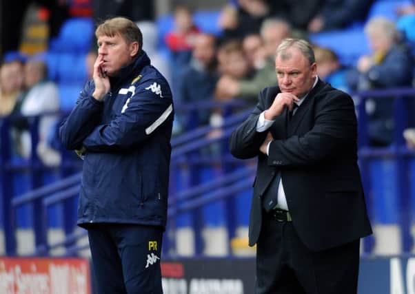Leeds United manager Steve Evans, right, and his assistant Paul Raynor pictured during last Saturdays defeat at Quuens Park Rangers (Picture: Jonathan Gawthorpe).