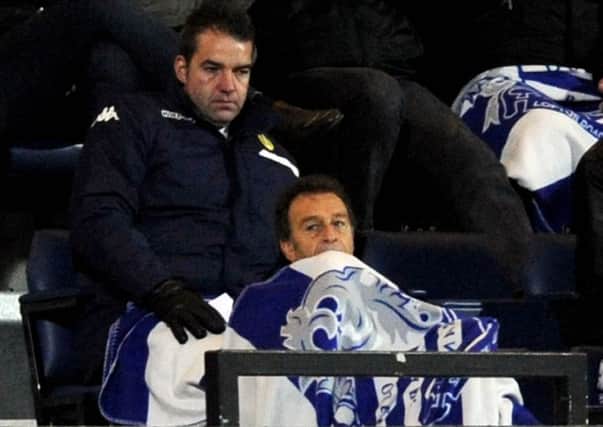 Massimo Cellino, trying to keep warm with a QPR blanket wrapped around him.