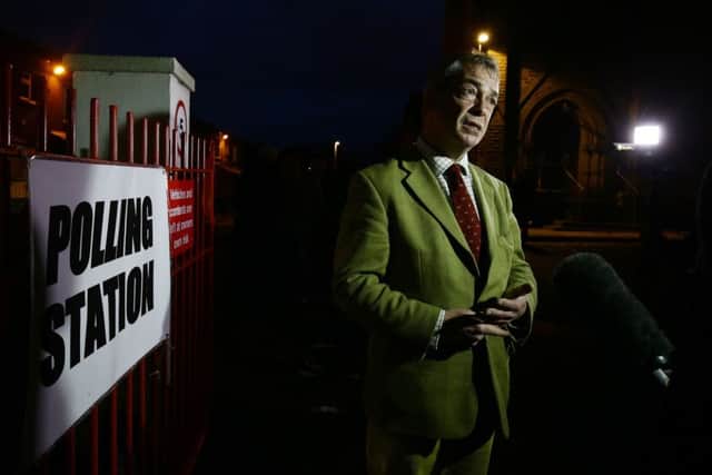 Ukip Leader Nigel Farage talks to reporters before a visit to a local polling station during the final few hours of voting in today's Oldham West and Royton by-election.