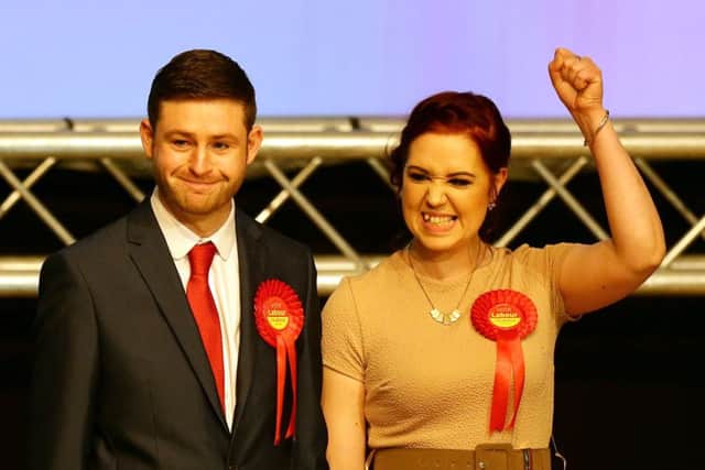 Labour candidate Jim McMahon with his partner Charlene  celebrates victory at the Oldham West and Royton by-election